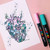 A lifestyle image of Posca PC-1M Extra-Fine Tip Paint Markers in use on paper.